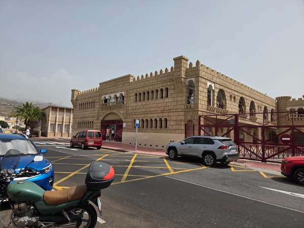 Street-side panorama of Castillo San Miguel’s fortress-style façade at the edge of Aldea Blanca village in Tenerife.