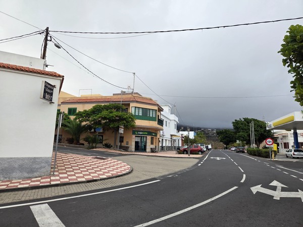 Cajasiete bank branch on a corner in Arico with green signage.