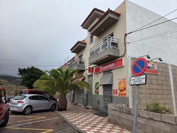 Superdipo supermarket entrance on the corner building in Arico.