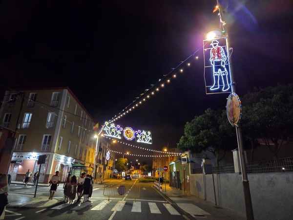 Arches of lights and a figure of a Canarian 'mago' marking the night route through La Laguna.