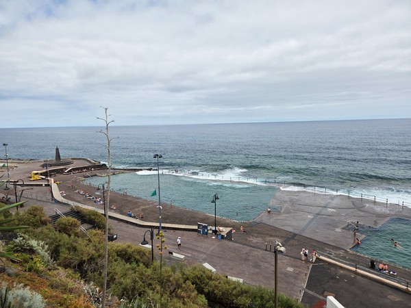 Panoramic view of the Bajamar natural ocean pools with the Atlantic and wave breakers in Tenerife.