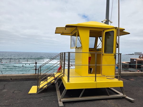 Lifeguard tower overlooking the Bajamar pools for swimmer safety.