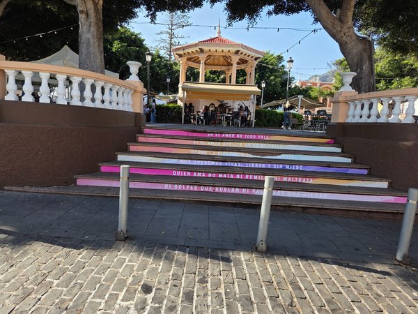 Staircase with painted social messages promoting respect and love in Buenavista square.