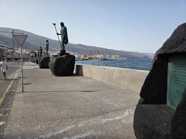 Guanche statues with coastal background