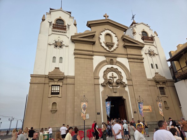 Close view of the basilica entrance as visitors arrive for events during Candelaria fiestas.