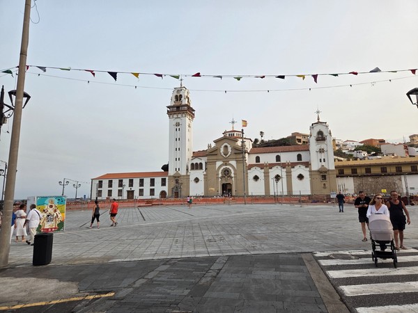 Wide view of the Basilica of Our Lady of Candelaria and the large seafront plaza set up for the August fiestas.