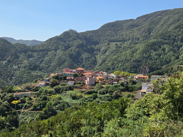 Panoramic view of Las Carboneras village surrounded by lush green mountains in Anaga Rural Park.