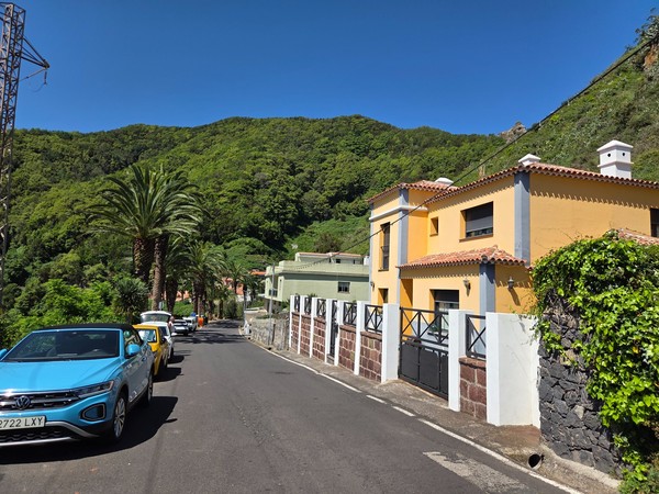Modern village houses and cars lining the quiet streets of Las Carboneras.