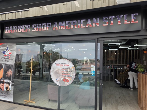 Barber Shop American Style with a special offer sign in the window.