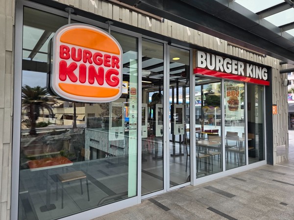 Burger King entrance with bright signage and glass frontage.