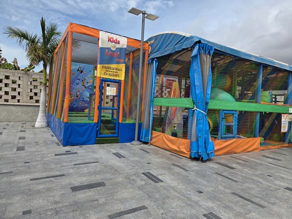 Kids Land play zone with climbing wall and cushioned obstacles.