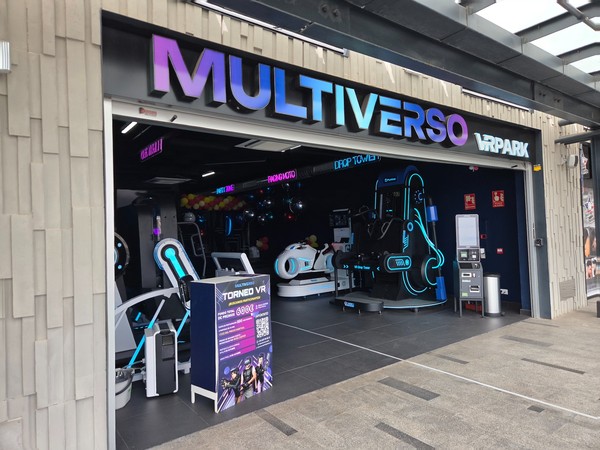 Multiverso VR Park filled with neon-lit motion rides and simulators.