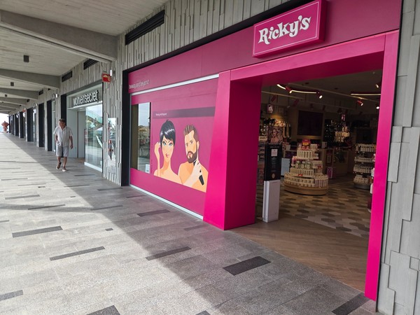 Ricky’s beauty store with shelves of cosmetics and personal care items.