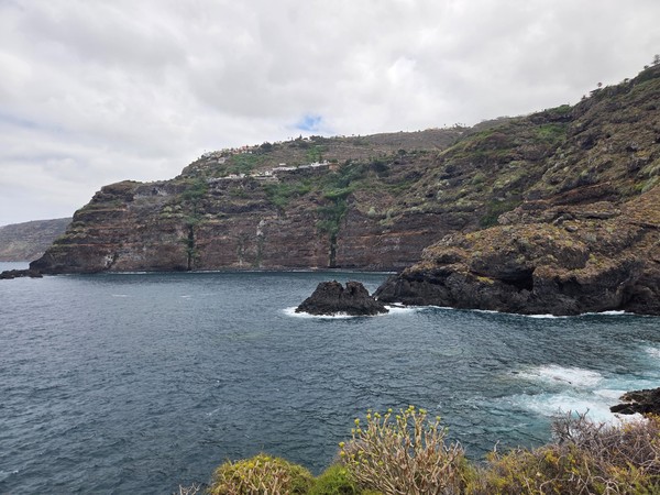 Panoramic view of the volcanic cliffs and bay along the Costa de Acentejo, Tenerife.