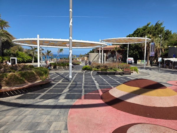 Design plaza with circular shade structures near the beachfront in Costa Adeje.