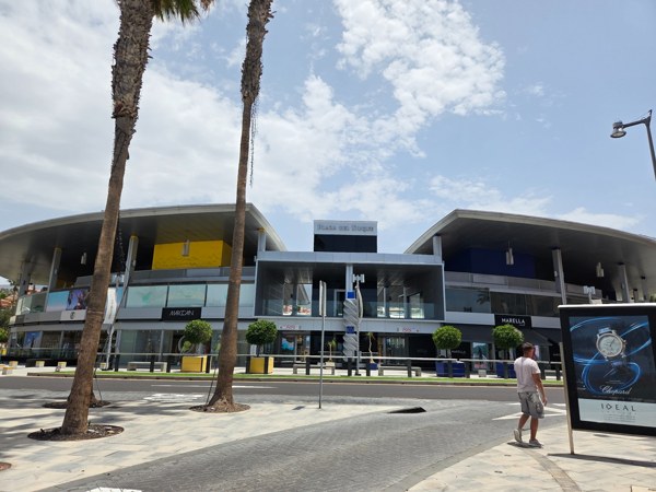 Modern, upscale Plaza del Duque shopping mall exterior in Costa Adeje.