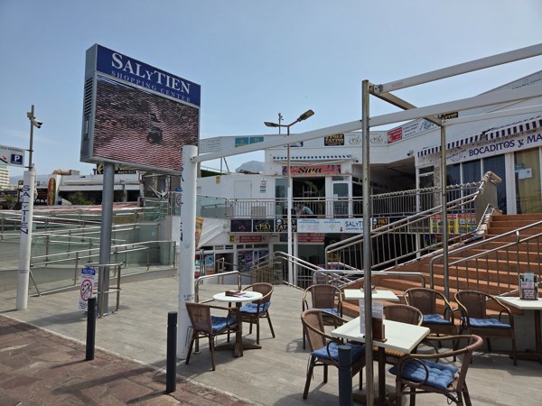 Terraces and signage at the Salytien Shopping Center on the seafront.