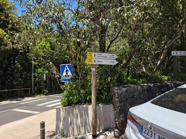 Directional hiking signs showing distances to Punta del Hidalgo, Bajamar, and El Batan
