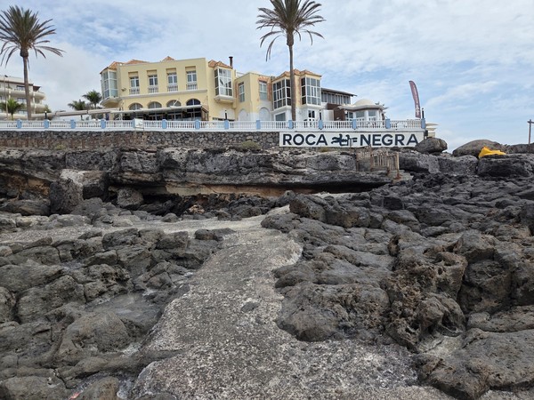 Facade of the Roca Negra area perched above the cliffs overlooking the rock pools of El Marquéz.