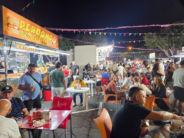 Perdomo Autobar food truck serving sandwiches and snacks to a full crowd at the El Fraile festivities.