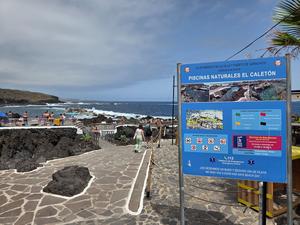 People enjoying the natural rock pools of El Caletón in Garachico, Tenerife.