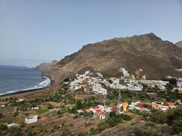 Wide panorama of Igueste de San Andres with the Anaga coast and rocky shoreline below.