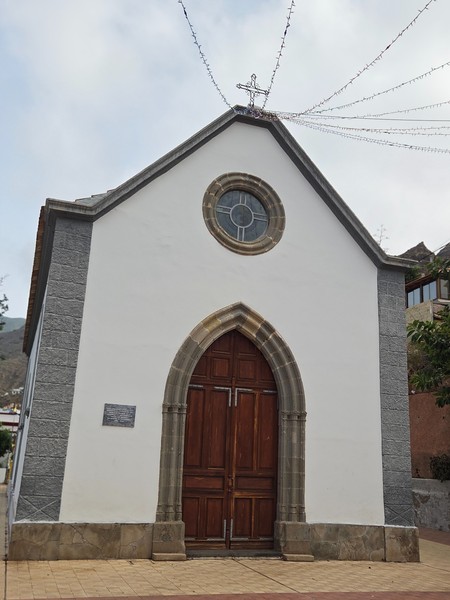 Ermita de San Pedro in Igueste de San Andres, a small chapel with arched wooden doors.