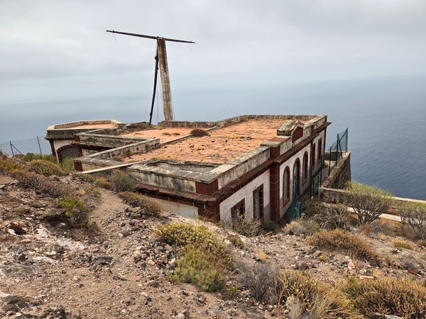 Abandoned El Semáforo building perched on the cliff over the Atlantic by Igueste de San Andres.