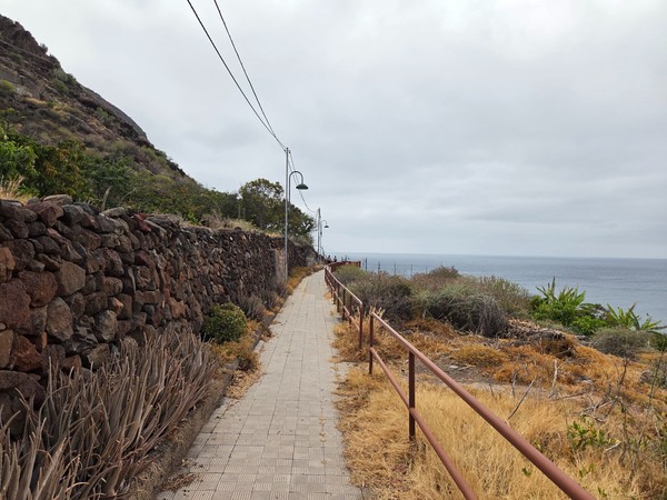 Stepped pedestrian path descending toward the sea in Igueste de San Andres.