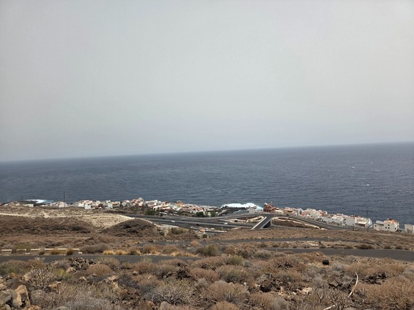 Panoramic view of La Caleta de Punta Prieta on Tenerife’s east coast with the TF-1 and compact village hugging the ocean.