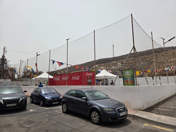 Sports court and community space decorated for local fiestas in La Caleta de Punta Prieta.