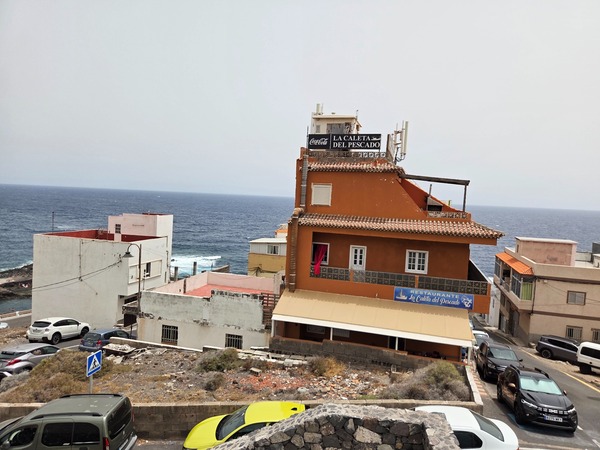 Facade of Restaurante La Caleta del Pescado above the sea in La Caleta de Punta Prieta.