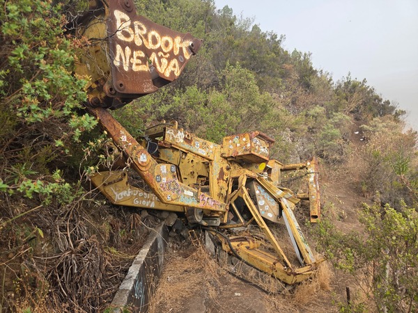 Abandoned excavator rusting beside the gallery, a reminder of the area’s industrial past.