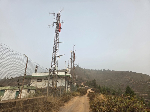 Row of communication masts lining the summit track above Güímar, near the start of the trail.