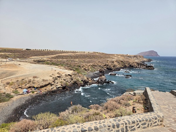 Rocky coastline and secluded cove on the opposite side of Los Abrigos village.
