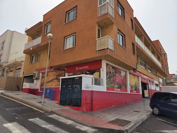 Corner building with a local supermarket SuperDino in Los Abrigos Tenerife.