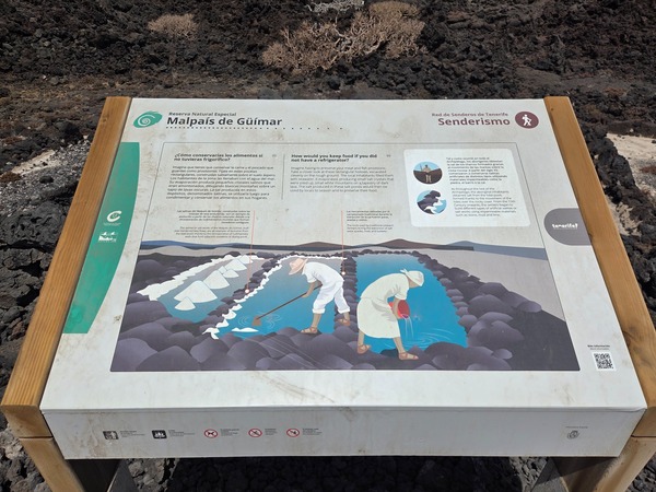 Interpretive panel describing traditional salt pans once used to preserve food on the Malpaís de Güímar coast.
