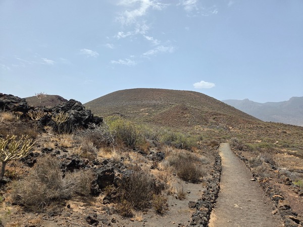 Footpath approaching the volcanic cone of Montaña Grande inside the Malpaís de Güímar reserve.