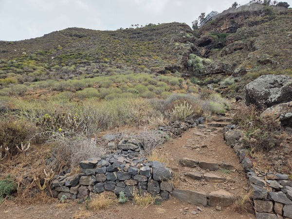 Rocky steps built with basalt stones on the lower section of the Las Breñas path.