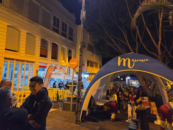 Organisation tent with volunteers and medical staff attending runners during La Nocturna Güímarera in Güímar.