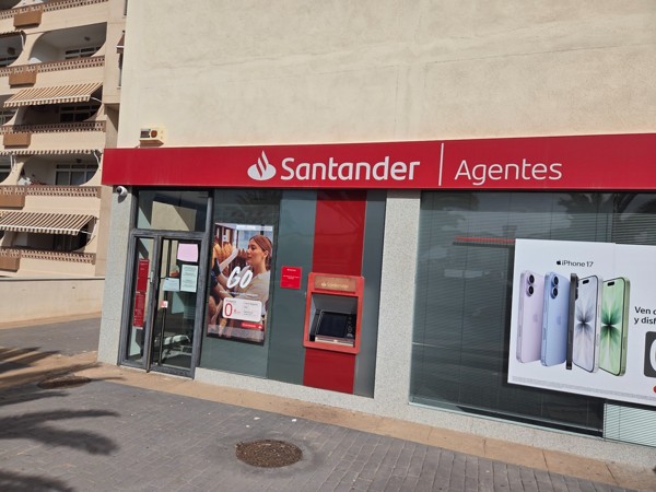 Santander Agentes office in Palm-Mar with ATM and advertising posters in the window.