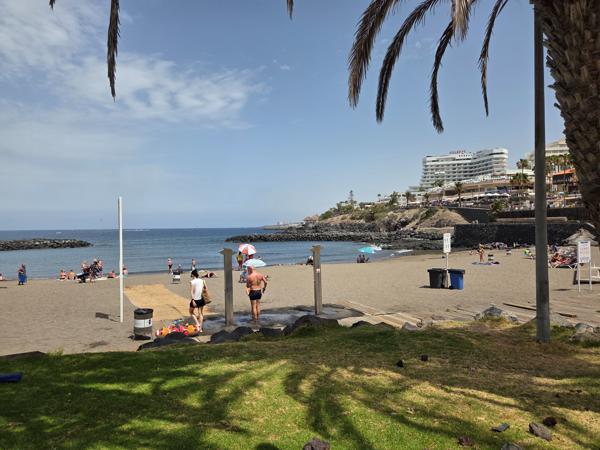 Beachgoers using the showers at Playa El Bobo