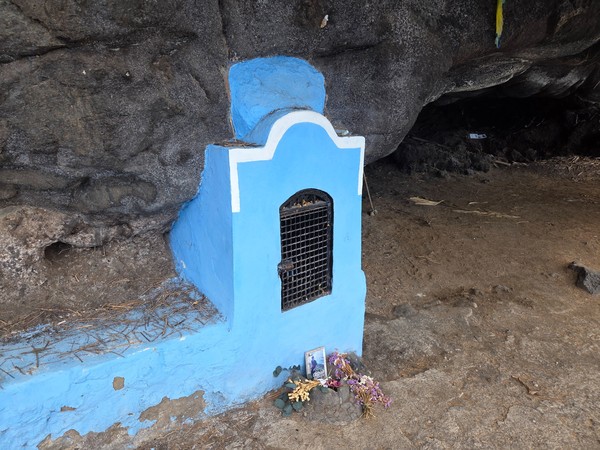 Small blue-painted shrine to Virgen del Carmen nestled in the basalt cave near the beach.