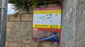 Informational and warning sign at the entrance to Playa El Ancón.