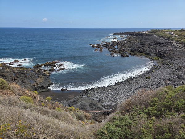 Panoramic view of Playa de Las Arenas bay and the Atlantic Ocean on Tenerife’s rugged north coast.