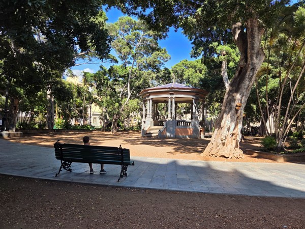 Close view of the octagonal bandstand with stone columns and steps in Plaza del Príncipe de Asturias.