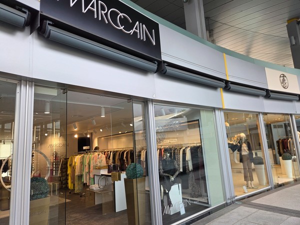 Marc Cain store showing women’s ready-to-wear collections with seasonal colors.