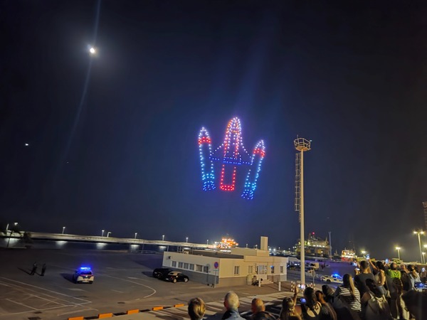 Rocket figure composed of drones, hovering high above the Santa Cruz harbor during the Plenilunio show.