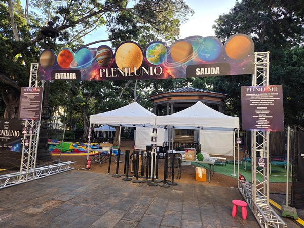 Activities entrance for families and children with inflatable games being set up. Taken at Plenilunio 2025 in García Sanabria Park, Santa Cruz de Tenerife.