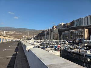 Path by the harbor with yachts